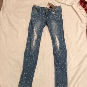 Ripped polkadot blue jeans